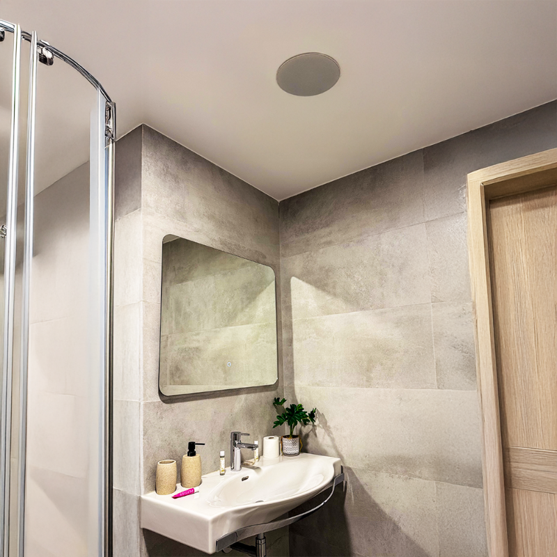 Bathroom with a sink, mirror, and shower area.