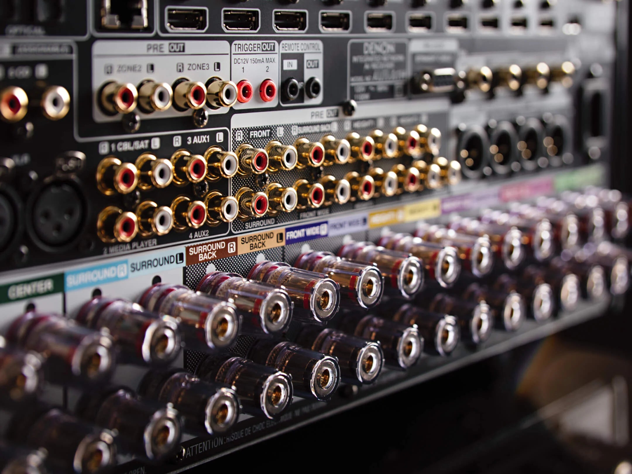 Close-up of a soundboard with various audio connectors.
