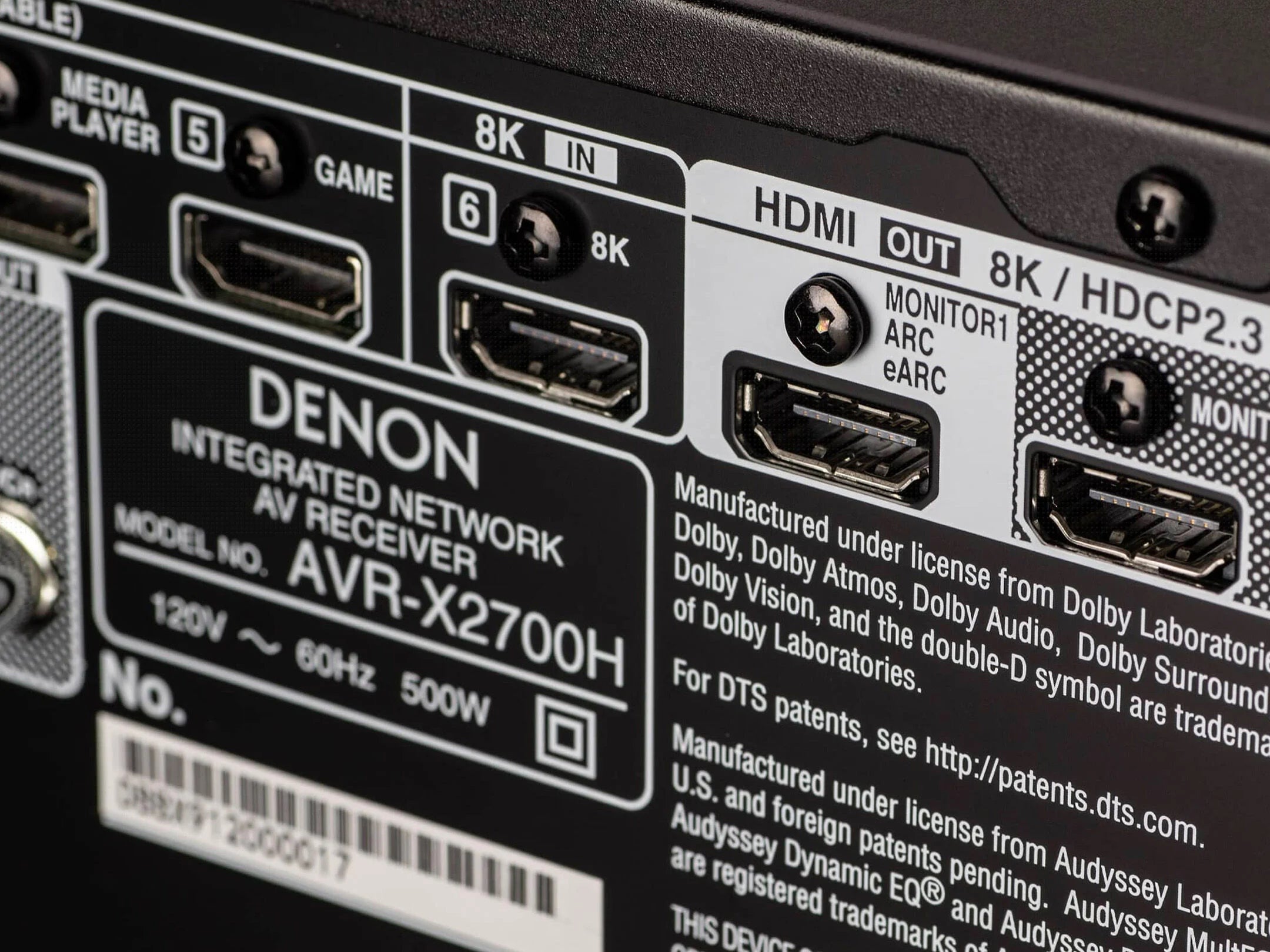 Back panel of a Denon AVR-X2700H AV receiver with multiple ports and branding.