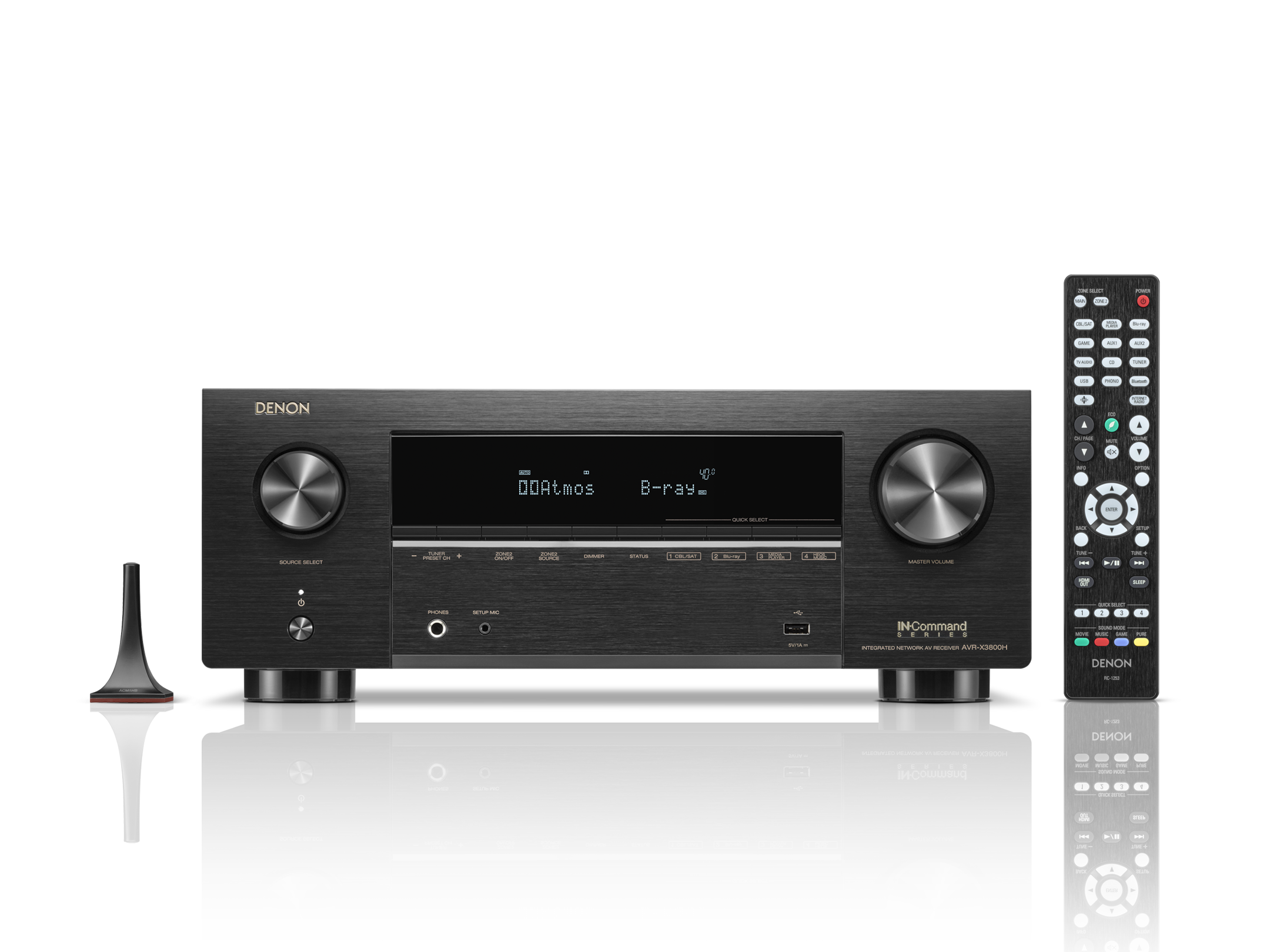 Black Denon audio receiver with remote control on a white background