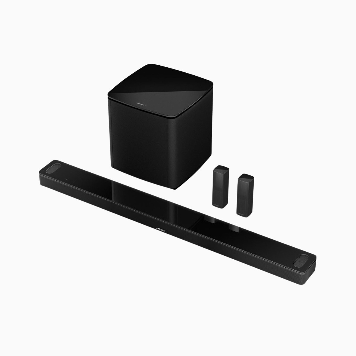 Black soundbar with subwoofer and remote controls on a white background