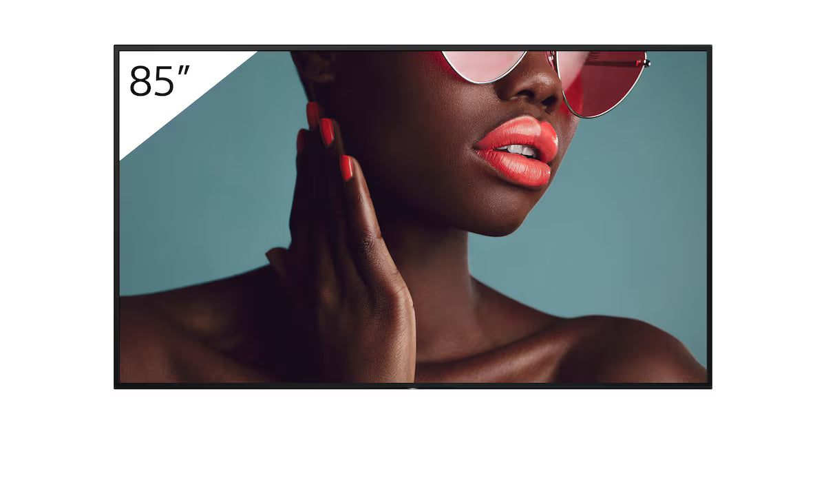 Woman wearing sunglasses with a 85-inch TV screen in the background