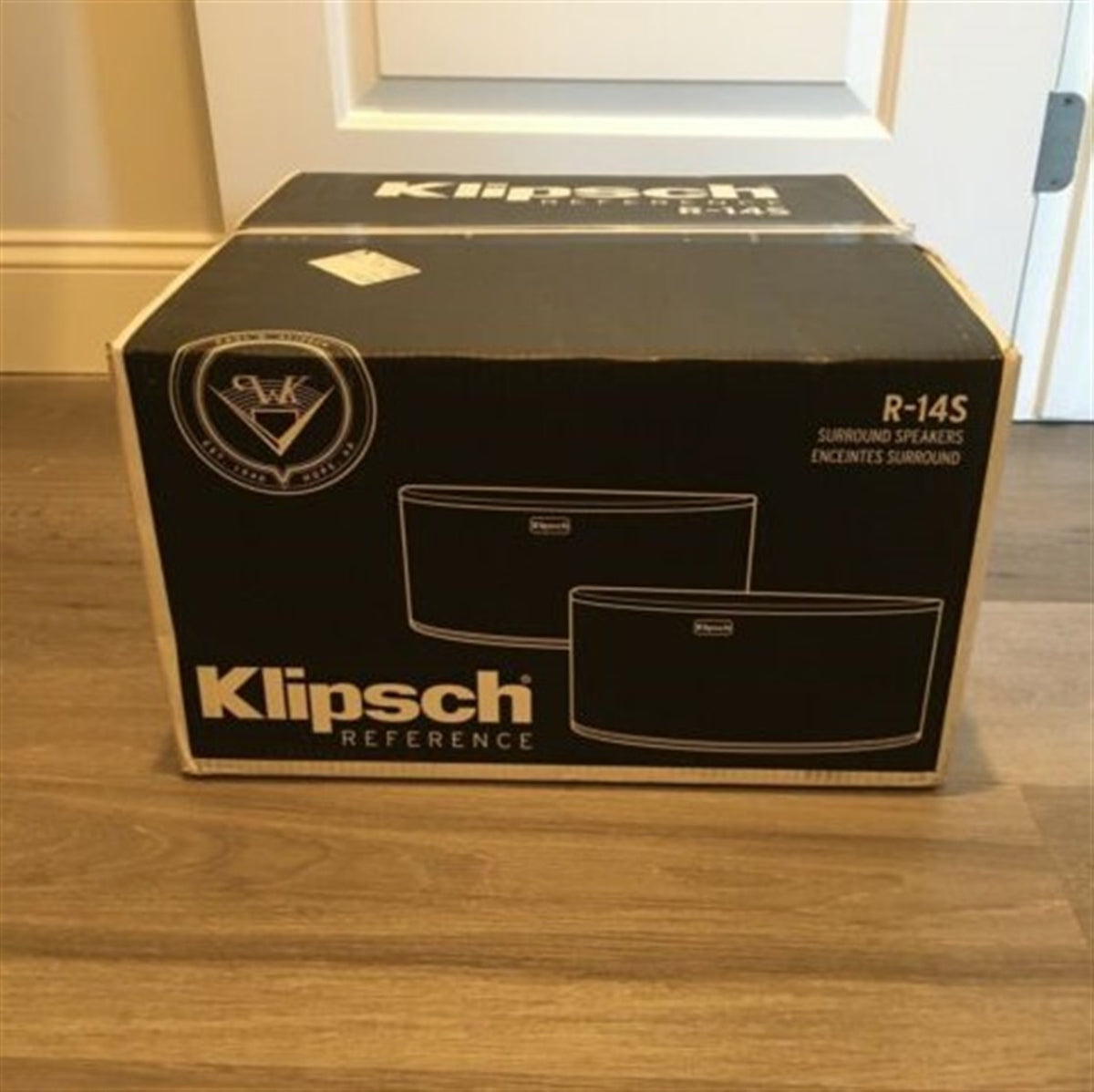 Klipsch Reference speaker box on a wooden floor
