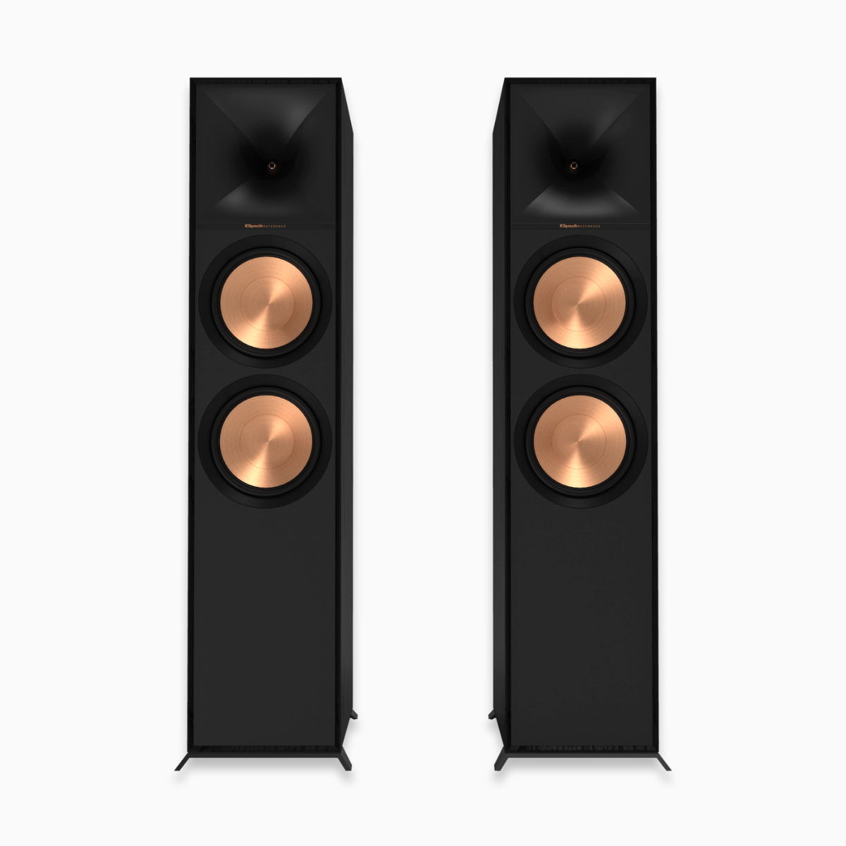 Pair of black floor-standing speakers with copper accents on a white background