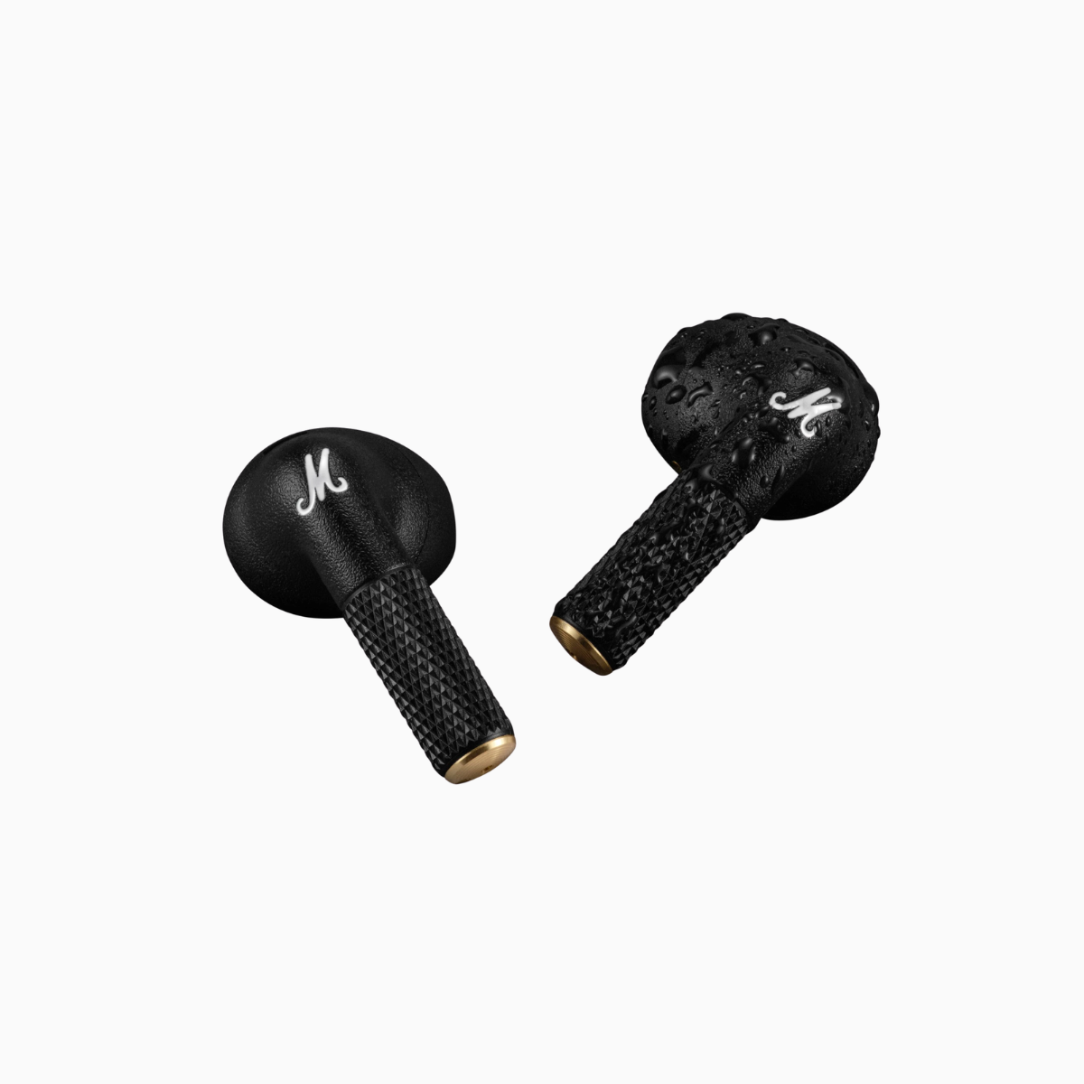 Two black microphone windshields with gold accents on a white background