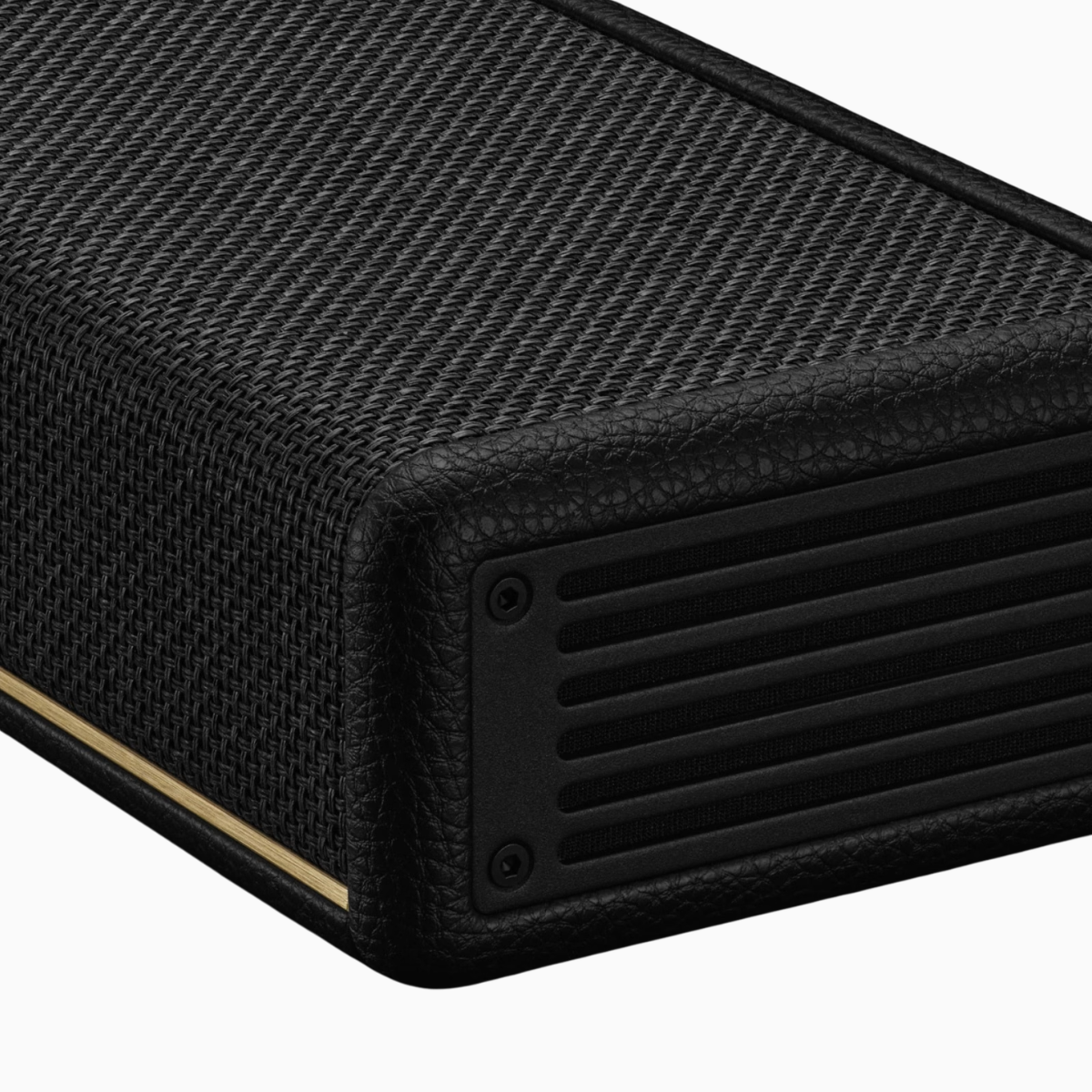 Black textured electronic device with a speaker grille on a white background