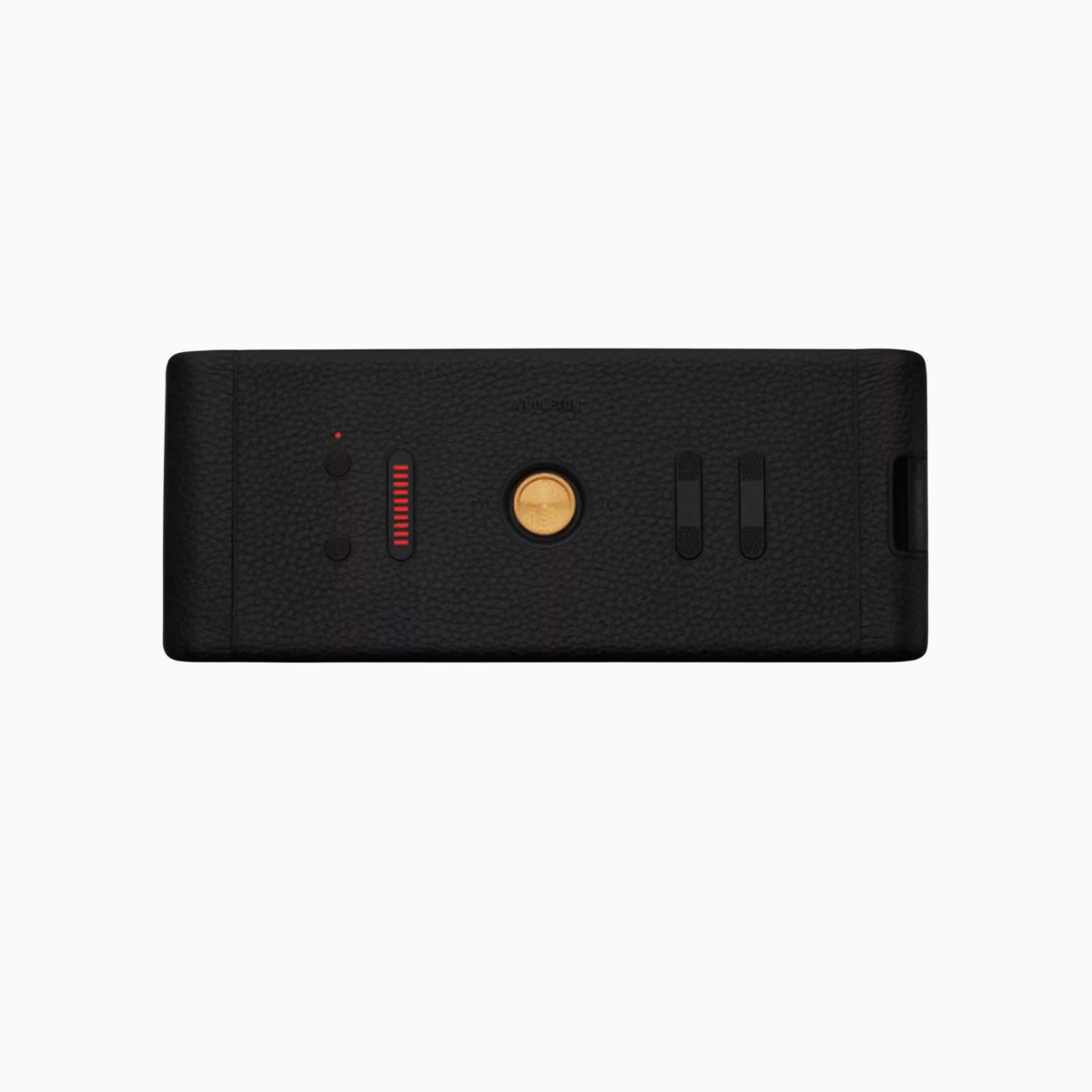 Black electronic device with a gold button on a white background