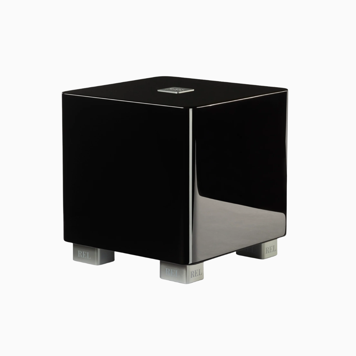 Black cube-shaped electronic device with metallic accents on a white background