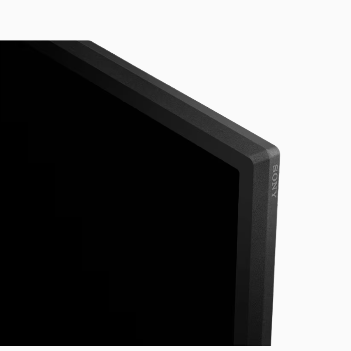 Corner of a black Sony electronic device on a white background