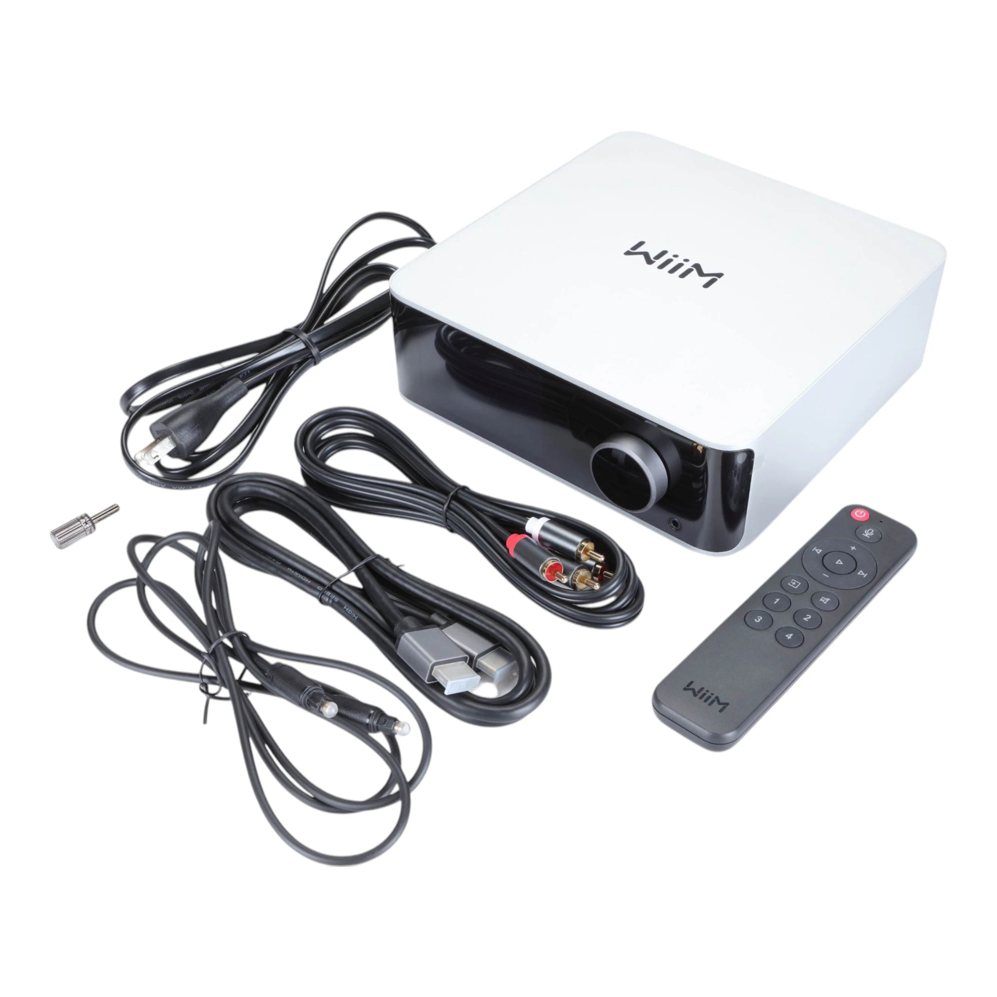 WiiM console with cables and remote on a white background