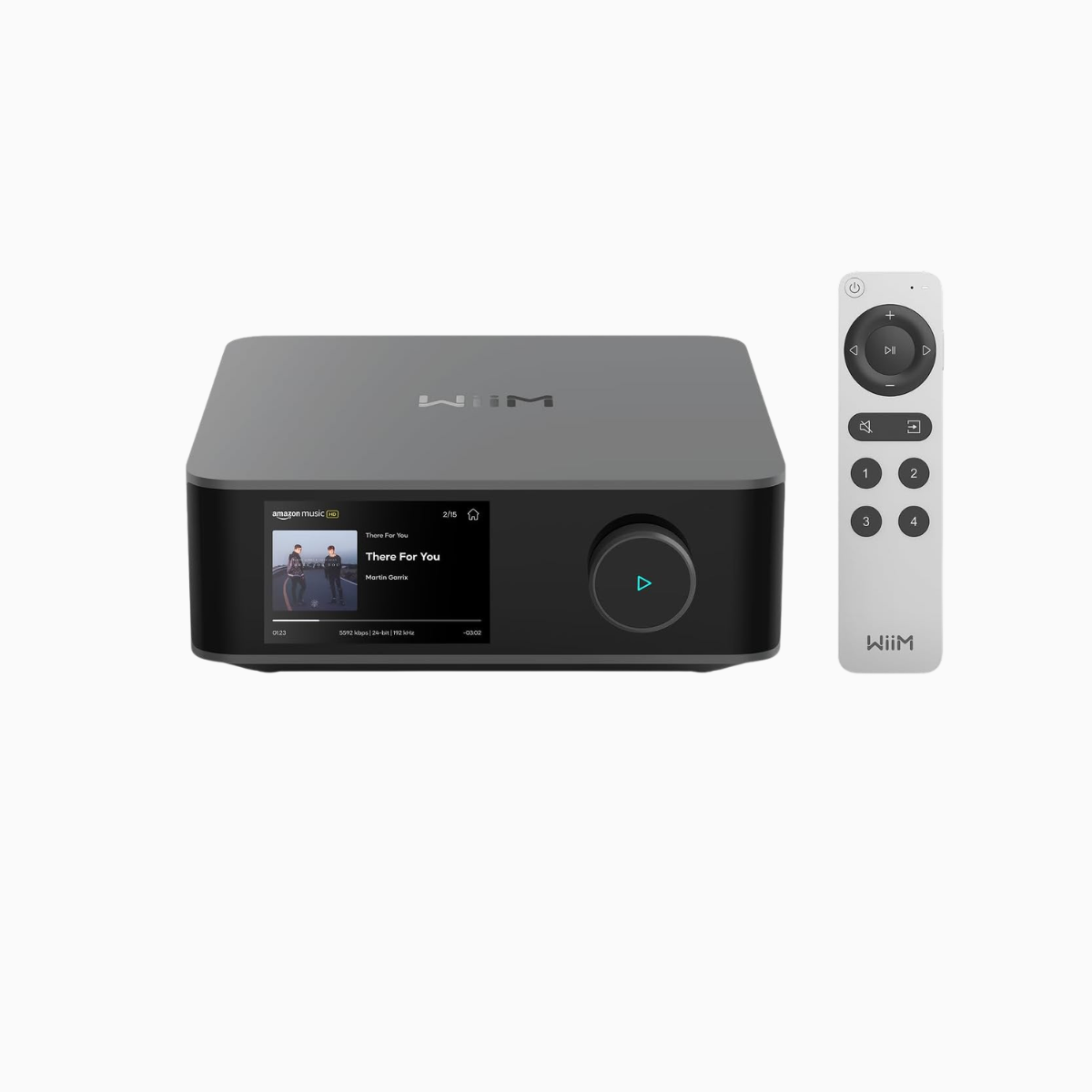 Black electronic device with screen and remote control on a white background