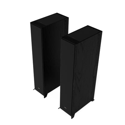 Two black floor-standing speakers on a white background