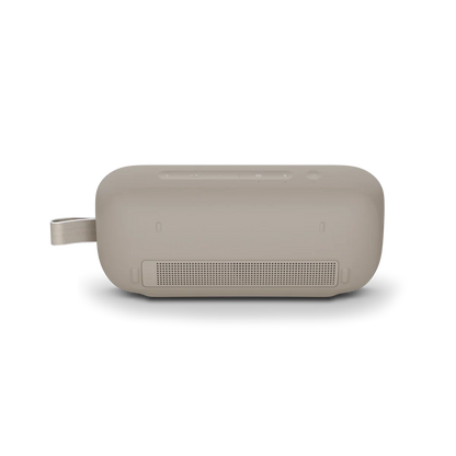 Beige rectangular speaker on a white background