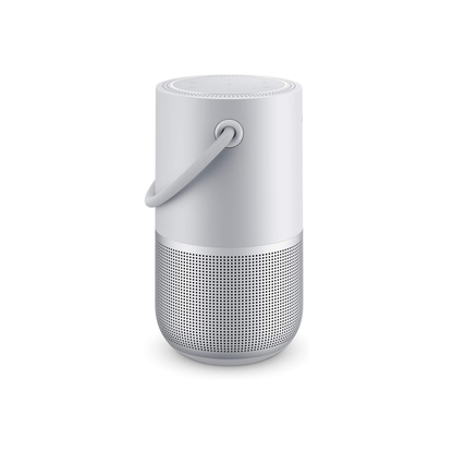 White portable speaker with a handle on a white background