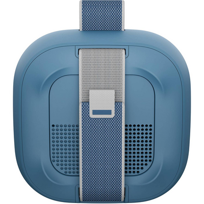 Blue portable speaker with a strap on a white background