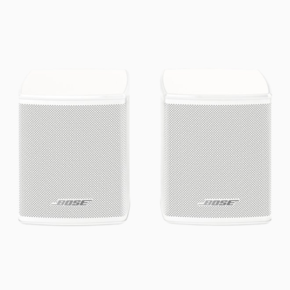 Two white Bose speakers on a white background