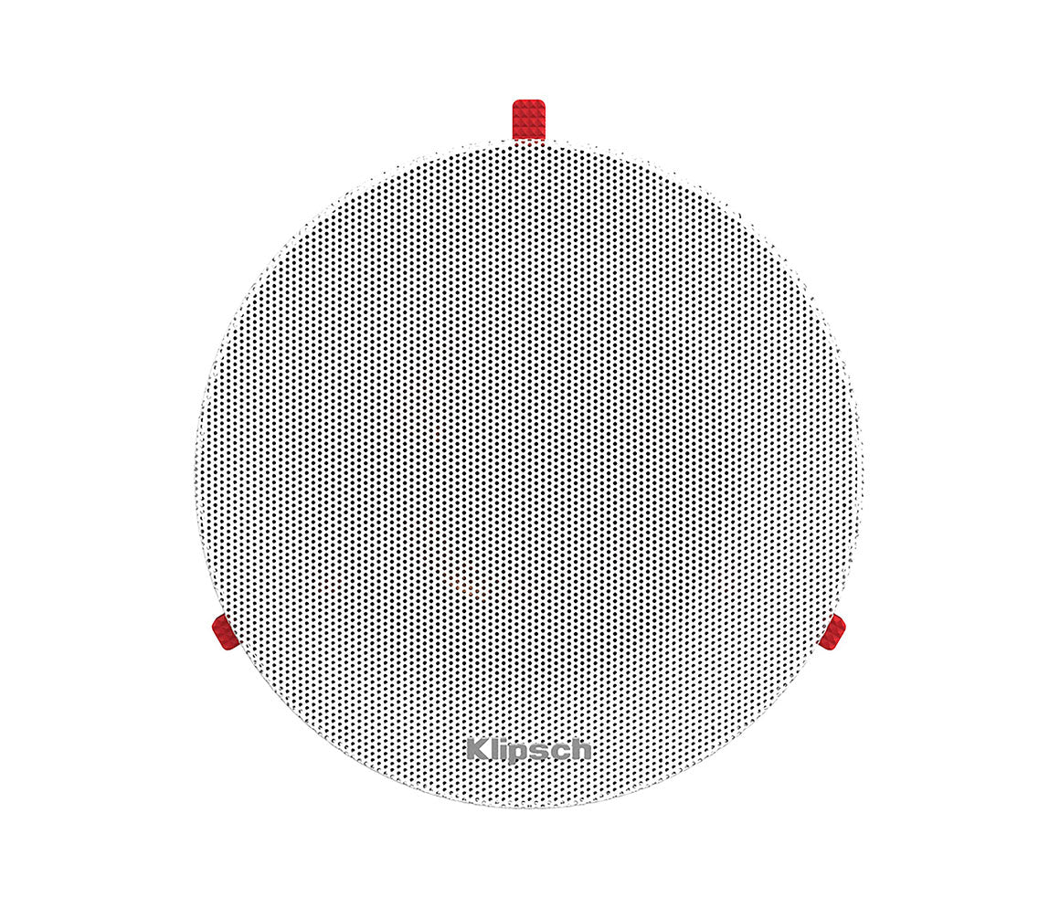 Round speaker grill with red accents on a white background