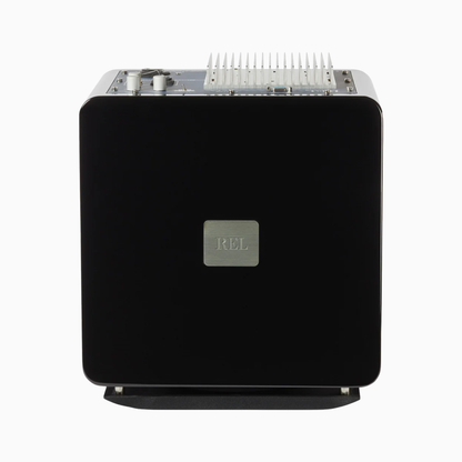 Black audio component with 'REL' logo on a white background