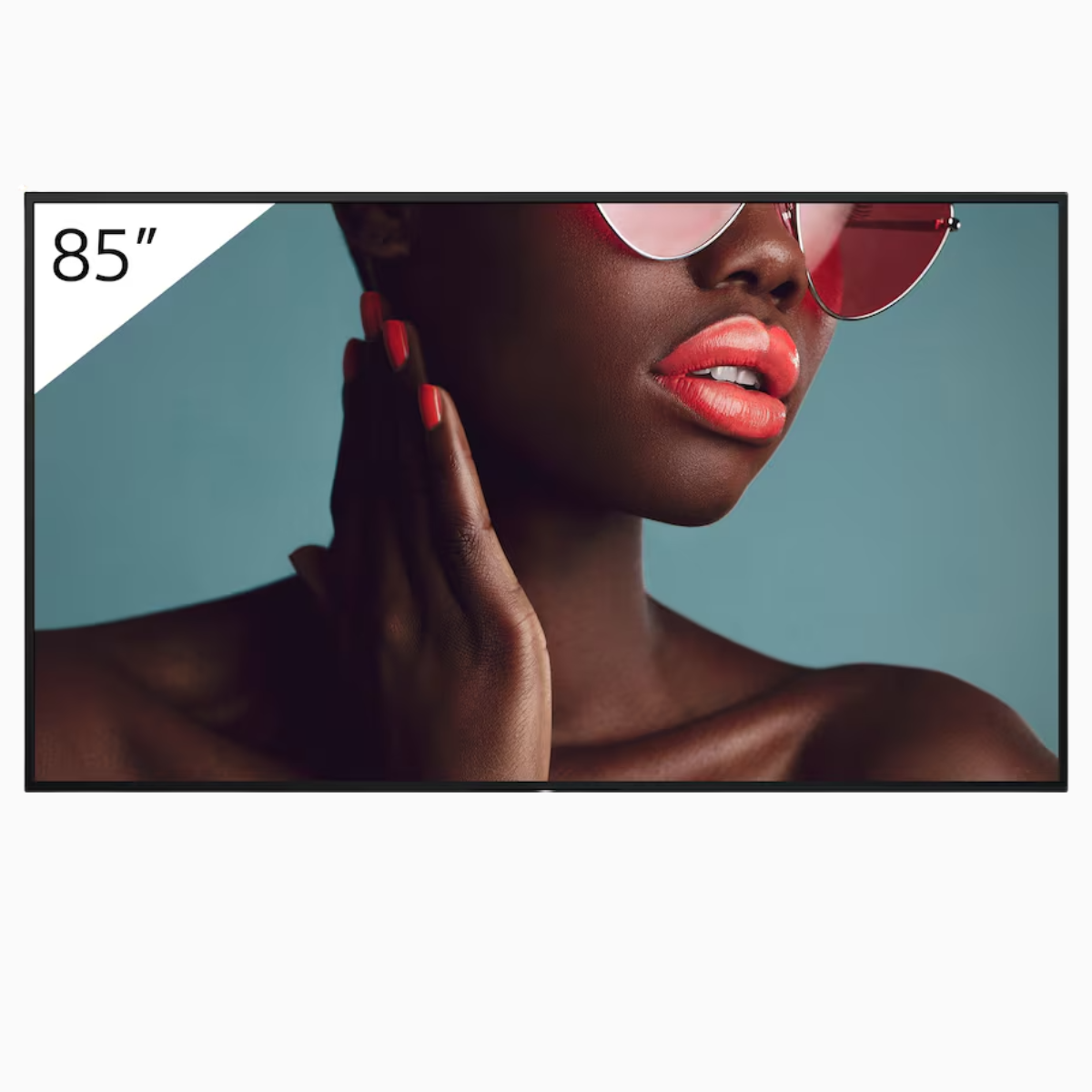 Woman wearing sunglasses with a 85-inch TV screen in the background