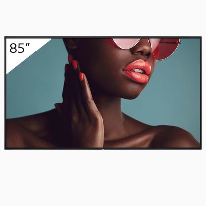 Woman wearing sunglasses with a 85-inch TV screen in the background
