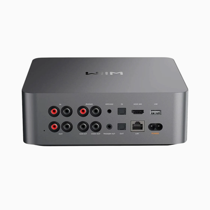 Back view of a gray electronic device with various ports on a white background