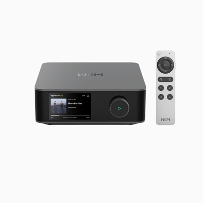 Black electronic device with screen and remote control on a white background
