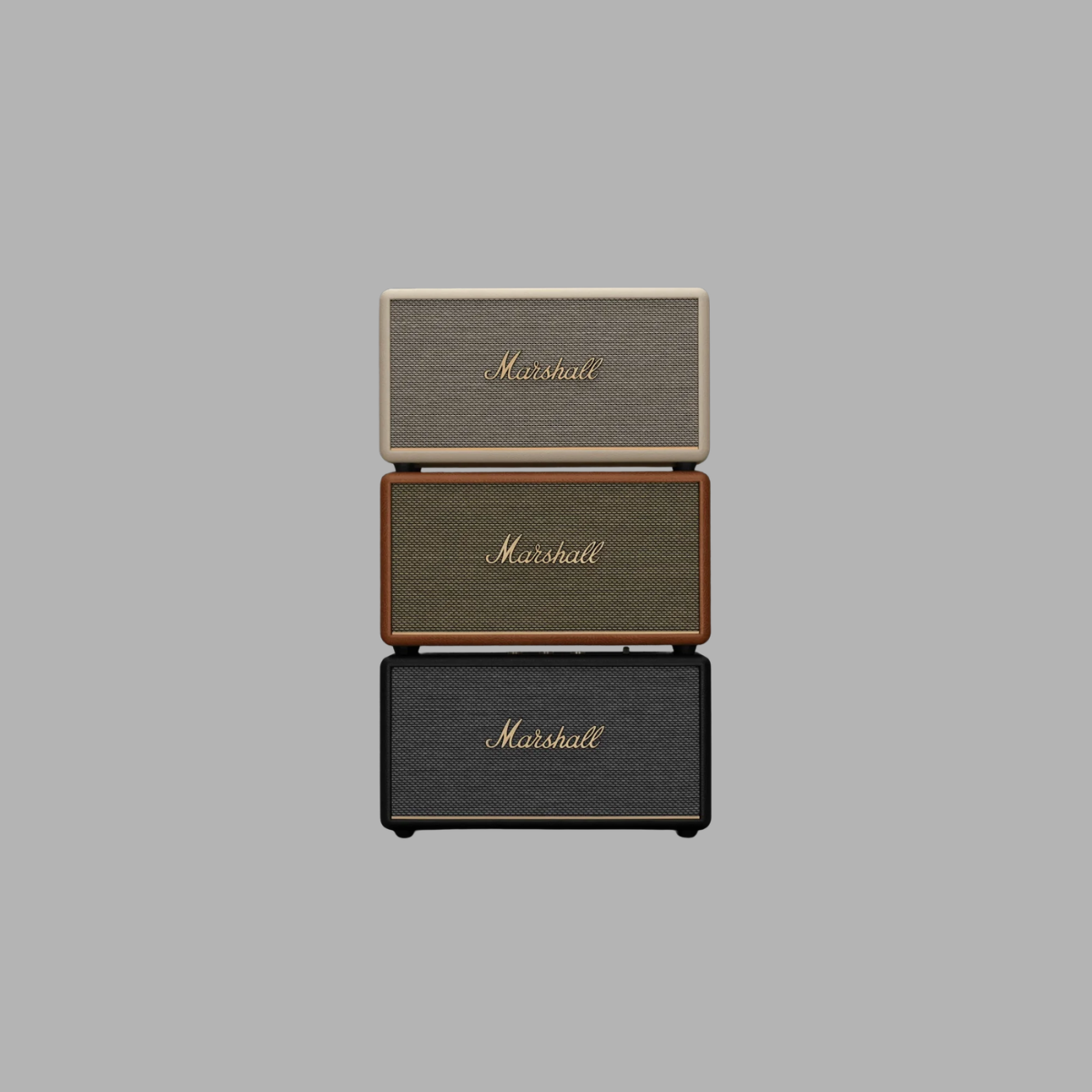 Three Marshall speakers stacked on a gray background