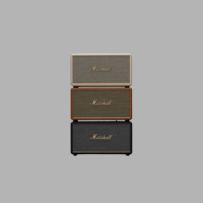 Three Marshall speakers stacked on a gray background