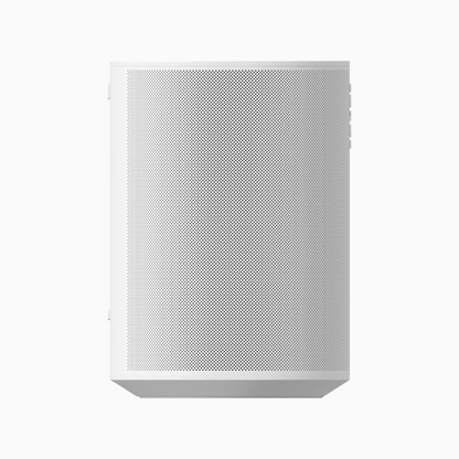 White speaker with perforated design on a white background